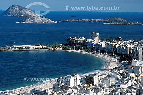  Aerial view of buildings in the neighborhood of Copacabana with the Forte de Copabacana (Copacabana Fort) jutting into the Atlantic Ocean in the left and Cagarras Islands in the background - Rio de Janeiro city - Rio de Janeiro state - Brazil 