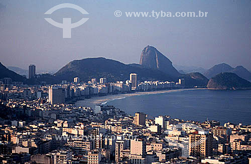  Aerial view of buildings in the neighborhood of Copacabana with the Sugar Loaf Mountain* in the background - Rio de Janeiro city - Rio de Janeiro state - Brazil  * Commonly called Sugar Loaf Mountain, the entire rock formation also includes Urca Mou 