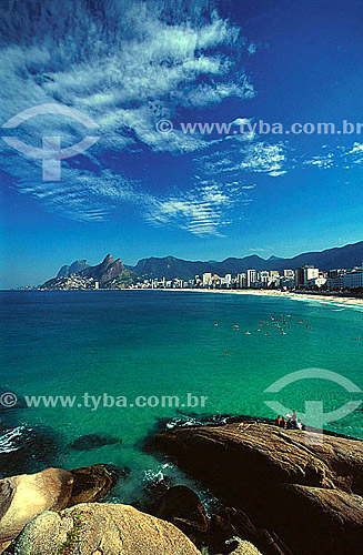  Ipanema beach as seen from Rock of Arpoador , with Rock of Gavea and Morro Dois Irmaos (Two Brothers Mountain) in the background and surfers on the water - Rio de Janeiro city - Rio de Janeiro state - Brazil 