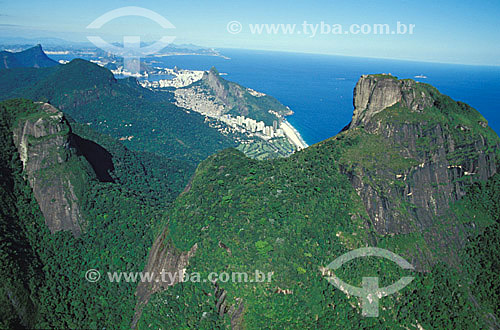  Aerial view of Gavea Rock in the foreground with Morro Dois Irmãos (Two Brothers Mountain) in the left, followed by Lagoa Rodrigo de Freitas (Rodrigo de Freitas Lagoon) and the Sugar Loaf Mountain in the background - Rio de Janeiro city - Brazil 