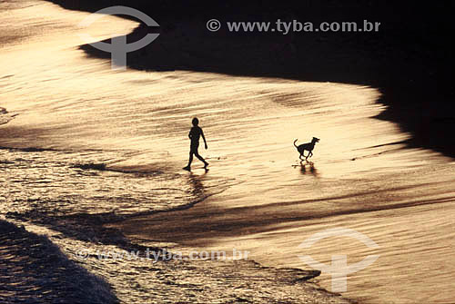  Boy with the dog at  Barra da Tijuca beach  - Rio de Janeiro city - Rio de Janeiro state - Brazil 