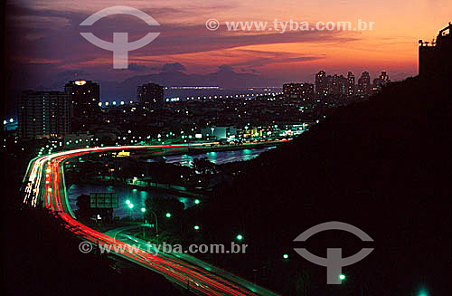  Barra da Tijuca at sunset, with the Elevado do Joa (Joa Elevated Road) illuminated by the lights of cars passing on the expressway - Rio de Janeiro city - Rio de Janeiro state - Brazil 