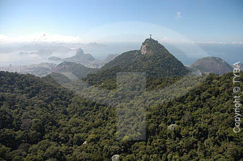  Aerial view of Cristo Redentor (Christ the Redeemer) at Morro do Corcovado (Corcovado Mountain) in Tijuca Forest, with the Sugar Loaf Mountain in the background - Rio de Janeiro city - Rio de Janeiro state - Brazil  