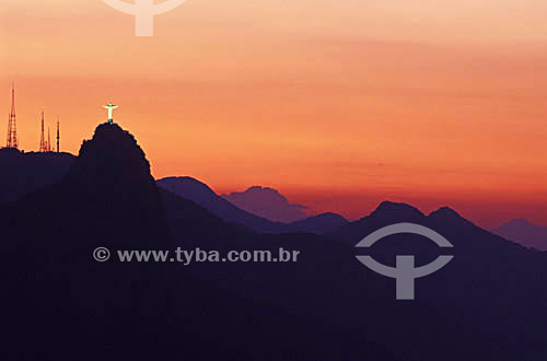  Silhouette of Cristo Redentor (Christ the Redeemer) and the Sumare antennas on Morro do Corcovado (Corcovado Mountain) at sunset - Rio de Janeiro - RJ - Brazil 