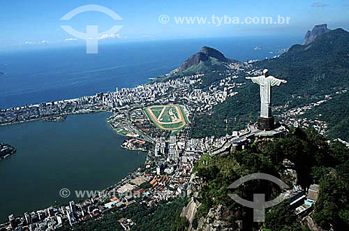  Aerial view of Christ the Redeemer, with part of Lagoa Rodrigo de Freitas (Rodrigo de Freitas Lagoon) to the left and the buildings of the neighborhood of Ipanema behind it, the Jockey Club to the right of the lagoon, and Morro Dois Irmaos  - Rio de Janeiro city - Rio de Janeiro state (RJ) - Brazil