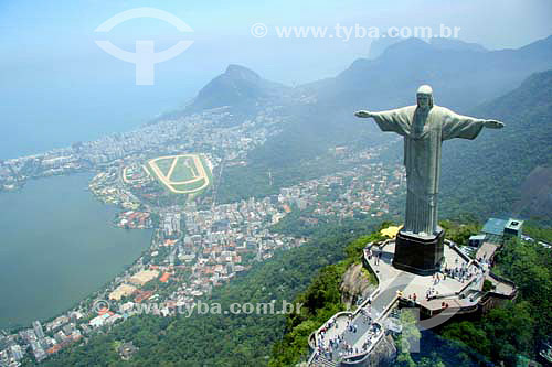  Aerial view of Christ the Redeemer, with part of Lagoa Rodrigo de Freitas (Rodrigo de Freitas Lagoon) (1) to the left and the buildings of the neighborhood of Ipanema behind it, the Jockey Club to the right of the lagoon, and Morro Dois Irmaos (Two  