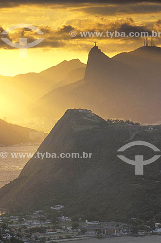  Sunset over Rio de Janeiro, with the statue of Cristo Redentor (Christ the Redeemer) on Morro do Corcovado (Corcovado Mountain) in the background - Rio de Janerio - Rio de Janeiro state - Brazil 