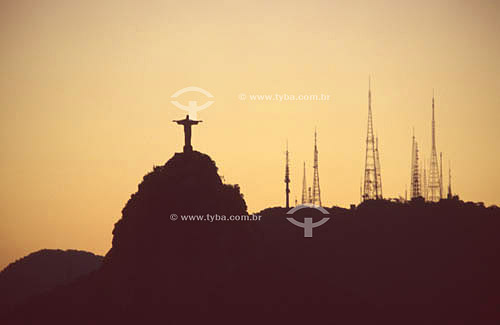  Silhouette of Cristo Redentor (Christ the Redeemer) at sunset and Sumaré antennas to the right - Rio de Janeiro city - Rio de Janeiro state - Brazil 