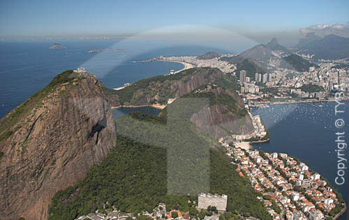  Aerial view of the Sugar Loaf Mountain showing the buildings of Urca neighborhood to he right and the Copacabana Beach at the left, in the background - Rio de Janeiro city - Rio de Janeiro state - Brazil 