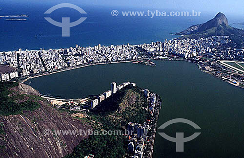  Aerial view of Lagoa Rodrigo de Freitas (Rodrigo de Freitas Lagoon) (1), with the buildings of the neighborhoods of Ipanema and Leblon behind it, part of the Jockey Club to its right, and Morro Dois Irmaos (Two Brothers Mountain) (2) in the backgrou 