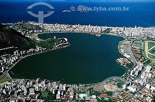  Aerial view of Lagoa Rodrigo de Freitas (Rodrigo de Freitas Lagoon)*, with buildings in the neighborhood of Jardim Botanico (Botanical Gardens) below it, buildings in the neighborhoods of Ipanema and Leblon above it, the Jockey Club to its right, an 