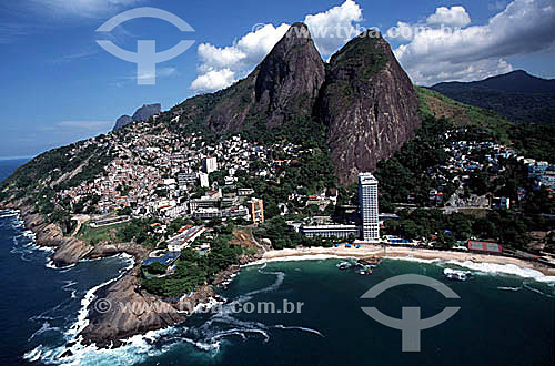  Aerial view of Morro Dois Irmaos (Two Brothers Mountain)*, with the Sheraton Hotal on Praia Vidigal (Vidigal Beach) in the foreground, and the houses of Vidigal slum on the hillside to the left - Rio de Janeiro city - Rio de Janeiro state - Brazil   