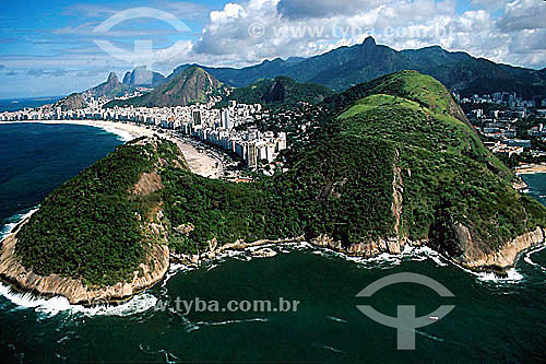  Aerial view of Morro do Leme (Leme Mountain) to the left and Morro da Babilonia (Babylonia Mountain)* to the right, which separate the neighborhoods of Urca and Copacabana, with Copacabana Beach on the left, followed by Morro Dois Irmaos (Two Brothe 