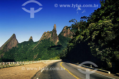  Road at Serra dos Orgaos with Gods Finger peak on the background - Terezopolis region - Rio de Janeiro state - Brazil 