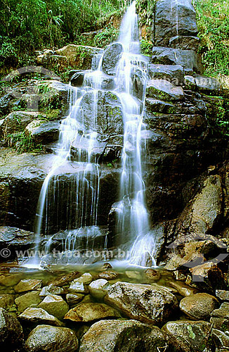  A waterfall in Itatiaia National Park*, in the south of the state of Rio de Janeiro - Brazil  *This is the oldest National Park in Brazil, created in 1937. It is located among the slopes and peaks of Serra da Mantiqueira, the mountain range which di 