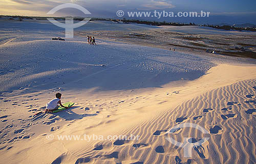  Child playing at a dune - Cabo Frio city - Rio de Janeiro state - Brazil 