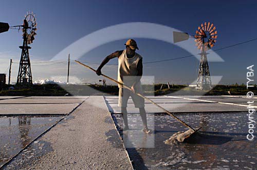  Worker in a saline with two windmills, typical to the region - Cabo Frio city - Regiao dos Lagos (Lakes Region) - Rio de Janeiro state - Brazil - February/2005 