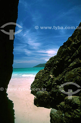  Praia do Pontal do Atalaia (Atalaia Point Beach) as seen from between two large boulders on shore - Arraial do Cabo city - Costa do Sol (Sun Coast) - Regiao dos Lagos (Lakes Region) - Rio de Janeiro state - Brazil 