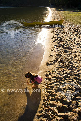  Girl playing in beach at costa da lagoa - Lagoa da Conceição lagoon - Florianopolis city - Santa Catarina state - Brazil 