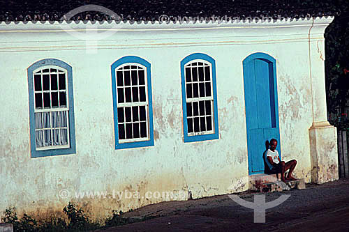  Man seated in front of the door - Santa Catarina state - Brazil 