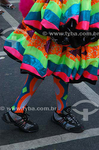  Detail of the legs and feet of a reveller dressed up in clovis costume (typical character of the street carnival of Rio de Janeiro) for the Carnival street party - 