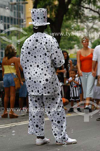  Reveller dressed up with white suit with black dots for the Carnival street party - 