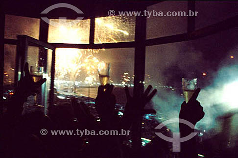  Detail of hands with champagne glasses - celebration of the New Year`s Eve - Rio de Janeiro city - Rio de Janeiro state - Brazil 