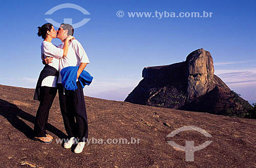  Couple kissing over a mountain with Gavea Rock in the background - Rio de Janeiro city - Rio de Janeiro state - Brazil 