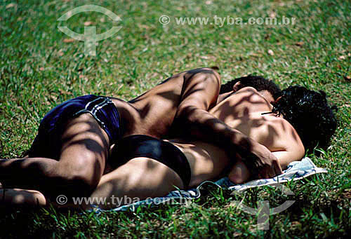  Couple lying down on the grass 
