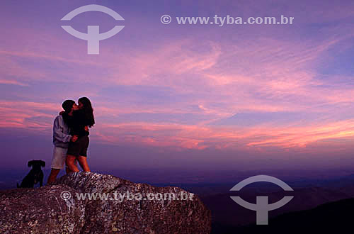  Couple kissing on the top of the Selada Rock - Mantiqueira Moutain Range - Rio de Janeiro state - Brazil 