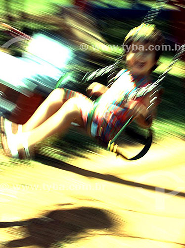  Child playing on the swing 