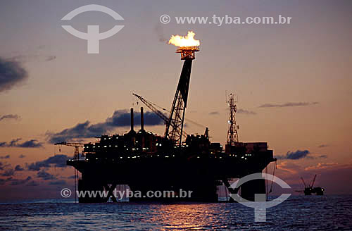  Oil industry - Oil platform during sunrise at Campos Bay - Rio de Janeiro state - Brazil 