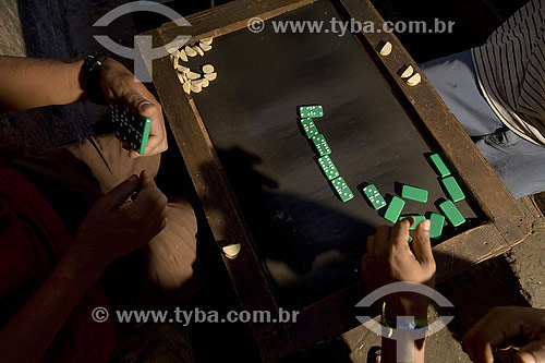  Men gambling with domino - at Sao Joaquim fair - Salvador city - Bahia state - Brazil 
