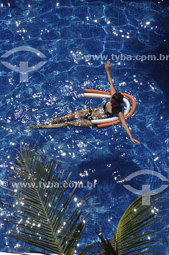  Woman with a buoy at swimming pool - Melia Hotel - Maceio city - Alagoas state - Brazil - March 2006 