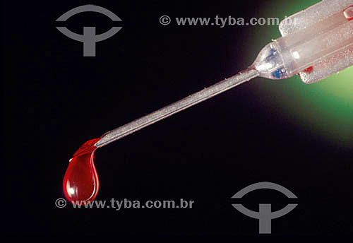  Syringe with a drop of blood 