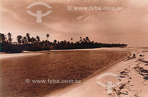  Man resting on the beach 