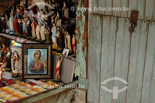  Religious Image of Nossa Senhora da Conceição and religious statuettes in a shop -  Porto das Caixas district - Itaboraí city - Rio de Janeiro state- Brazil - january, 2007  