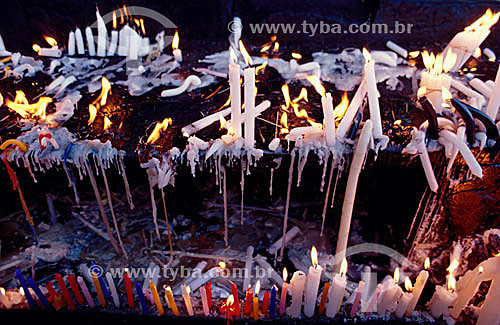  Candles lit and melted inside the grotto of the Sanctuary of Bom Jesus da Lapa - Bom Jesus da Lapa village - Bahia state - Brazil 