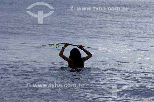 Woman in the sea offering flowers - Orixas - Iemanjá cult - Umbanda and Candomble - African Brazilian religion - New Year`s Eve - Copacabana Beach - Rio de Janeiro city - Rio de Janeiro state - Brazil  - 2005 