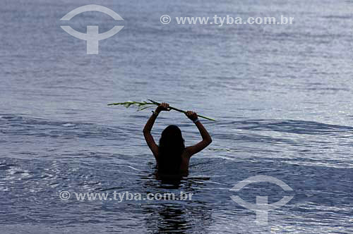  Woman in the sea offering flowers - Orixas - Iemanjá cult - Umbanda and Candomble - African Brazilian religion - New Year`s Eve- Copacabana Beach - Rio de Janeiro city - Rio de Janeiro state - Brazil  - 2005 