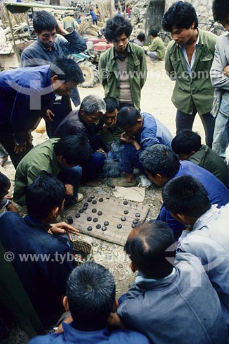  Subject: Men playing typical board game Place: China 