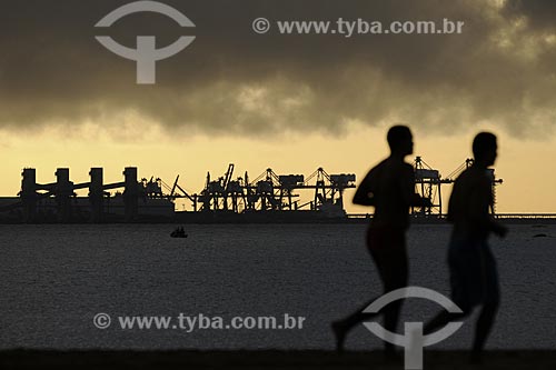  Subject: Man practicing race on Praia de Camburi Beach with the Tubarao Complex in the background / Place: Vitoria - Espirito Santo state - Brazil / Date: March 2008 