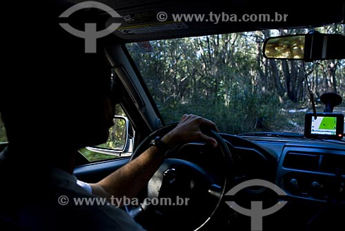  Subject: Man inside the car using GPS (Global Positioning System) / Place: Florianopolis City - Santa Catarina State - Brazil / Date: May 2009 