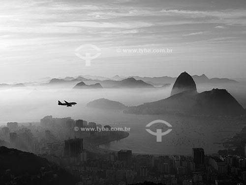  Subject: View of Pao de Açucar (Suggar Loaf) and Botafogo Bay at dawn with airplane passing / Place: Rio de Janeiro City - Rio de Janeiro State - Brasil / Date: June 2009 