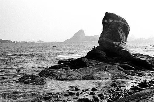 Subject: Stone of Itapuca with the Pao de Açucar (Sugar Loaf) behind  / Local: Beach of Inga, Niteroi - RJ  / Date:  Julho de 2005 