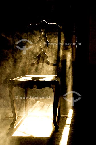  Subject: Chair covered in dust in backlight / Local: Abandoned house in the Center of Rio de Janeiro / Date:  Agosto de 2007 