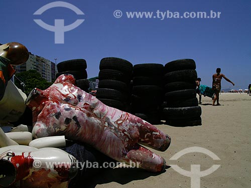  Manifestation against violence at Copacabana Beach, organized by Rio de Paz (Peace in Rio - NGO). A pile of tires and bloody mannequins represent thousands of people that are vanished in Rio de Janeiro  - Rio de Janeiro city - Brazil