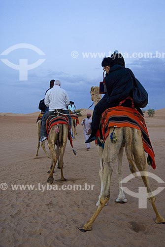  Subject: Ride on the backs of dromedaries in the desert  / Place: Dubai - United Arab Emirates  / Date: Janeiro 2009 
