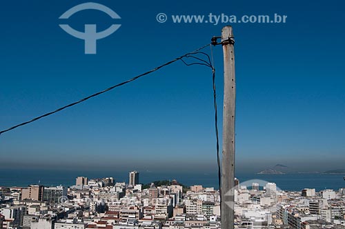 Subject: Improvised lamppost of power energy in Cantagalo favela with nice view of Ipanema district in the background  / Place: Rio de Janeiro city - Rio de Janeiro state - Brazil  / Date: 06/2010 