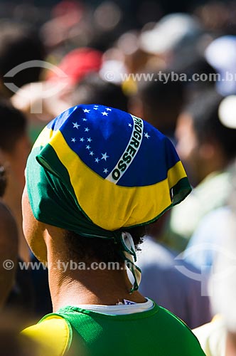  Subject:  Fan with Brazilian Flag Watching a Soccer  Game During FIFA World Cup 2010 / Place: Sao Paulo city - Sao Paulo state - Brazil / Date: 07/2010 